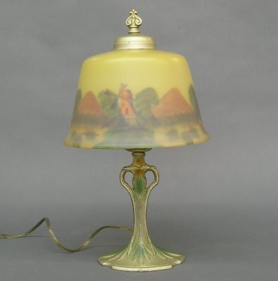 Boudoir lamp: A 1920's period boudoir lamp with painted White metal base and reverse painted glass shade. Minor wear. 14 1/2" high. ESTIMATE $200-400