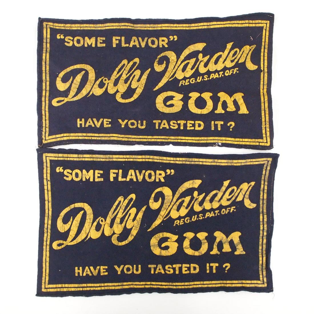 2 Candy Store Counter Mats: Two early 20th century Candy Store counter mats. Advertising "Dolly Varden Gum" in painted decoration on purple felt. Some wear and minor losses to decoration. Each 11 3/4 x 6 14" high overall. ESTIMA