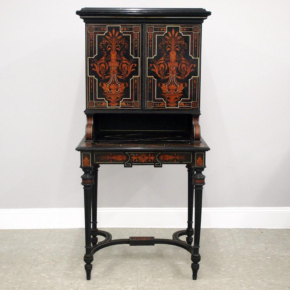 Aesthetic Period Secretaire: An American Aesthetic Period secretaire. Mixed wood construction with extensive pictoral inlays and ebonized detail. Molded top over two panel doors which open to reveal an interior fitted with two up
