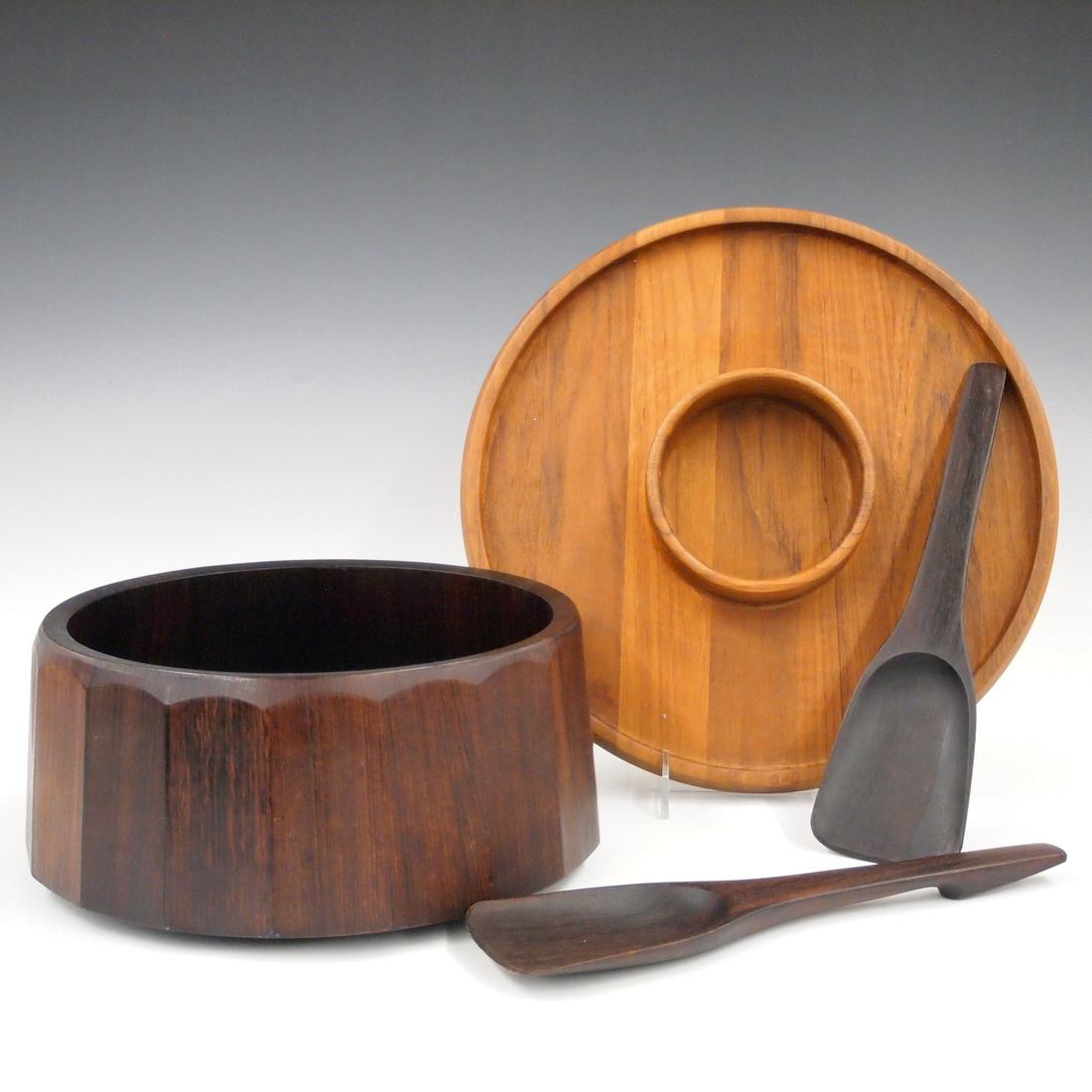 Midcentury Woodenware: Two pieces of midcentury woodenware serving pieces. Rosewood salad serving bowl and two serving utensils, and a "Dansk" teak chip-and-dip. Original finishes, small shrinkage crack. Salad bowl is 10 1/