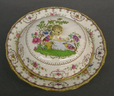 Spode covered dish: A turn of the century Spode "Chelsea" pattern covered dish. Transfer decoration with hand painted detail. Printed and painted marks. Slight wear. 8 3/4" diameter. ESTIMATE $40-60