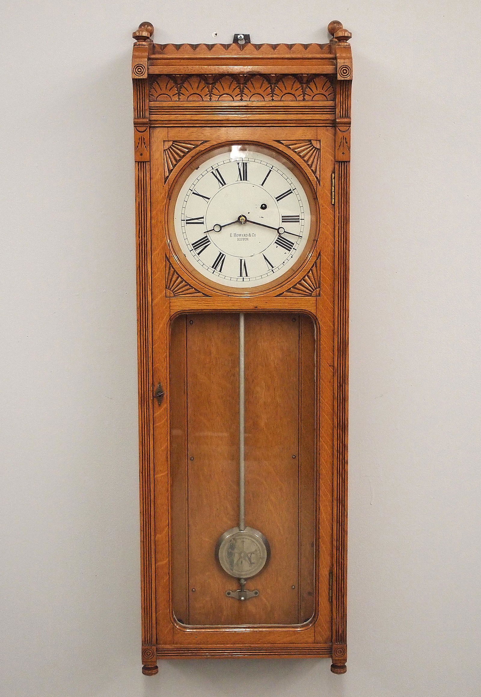 Howard Model 58-8 Wall Clock: A late 19th century E. Howard & Co. model 58-8 wall clock. 8-day weight driven time only movement marked "E. Howard & Co. Boston, 5" with 8 1/2" painted metal dial and Roman numerals marked "E. Howard