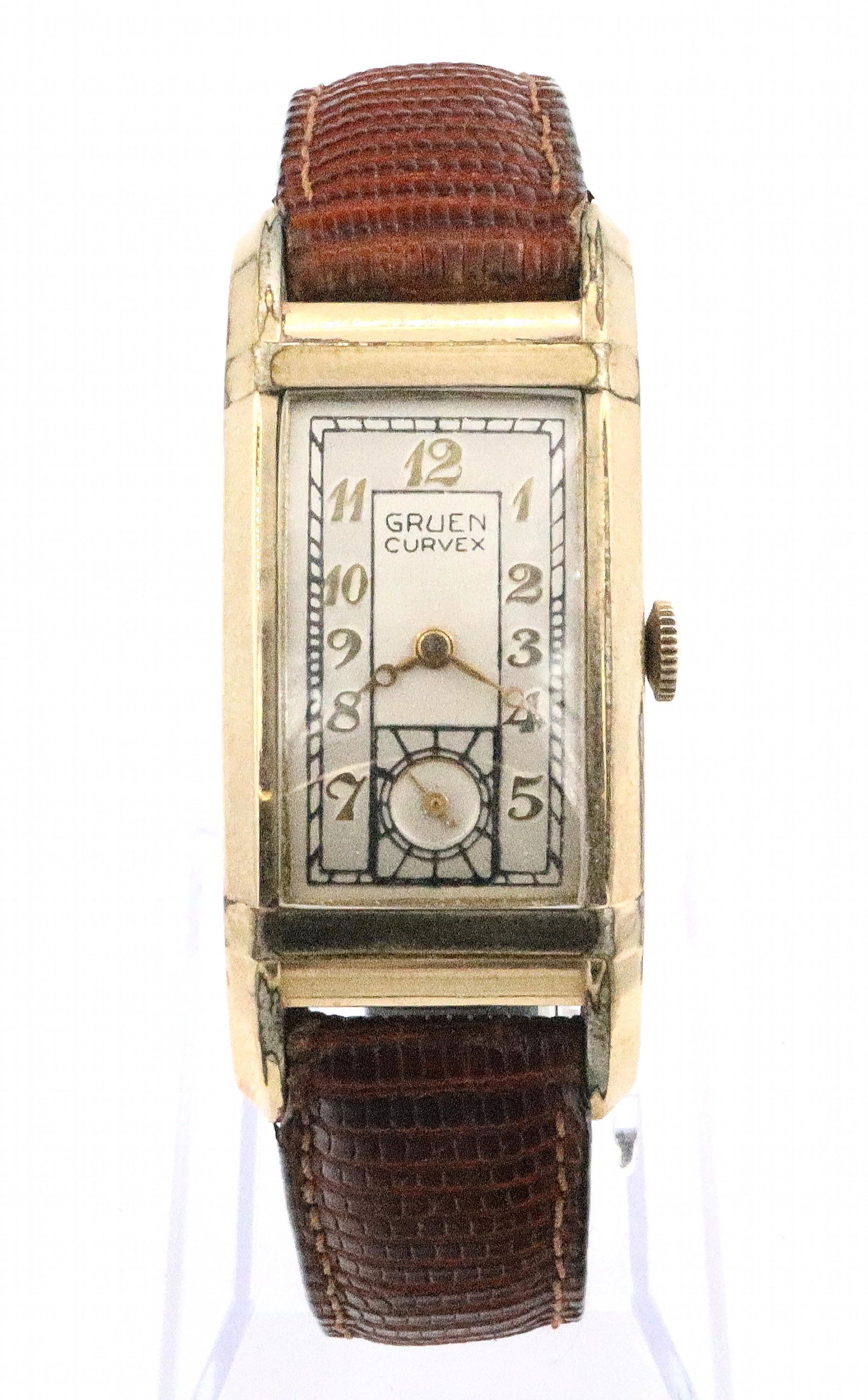 Gruen Curvex Wristwatch: A vintage Gruen Curvex model gentleman's wristwatch. 15j manual wind movement with Silvered dial, Arabic numerals and subsidiary seconds. 20 x 32 mm Gold filled case with Stainless back and replaced l