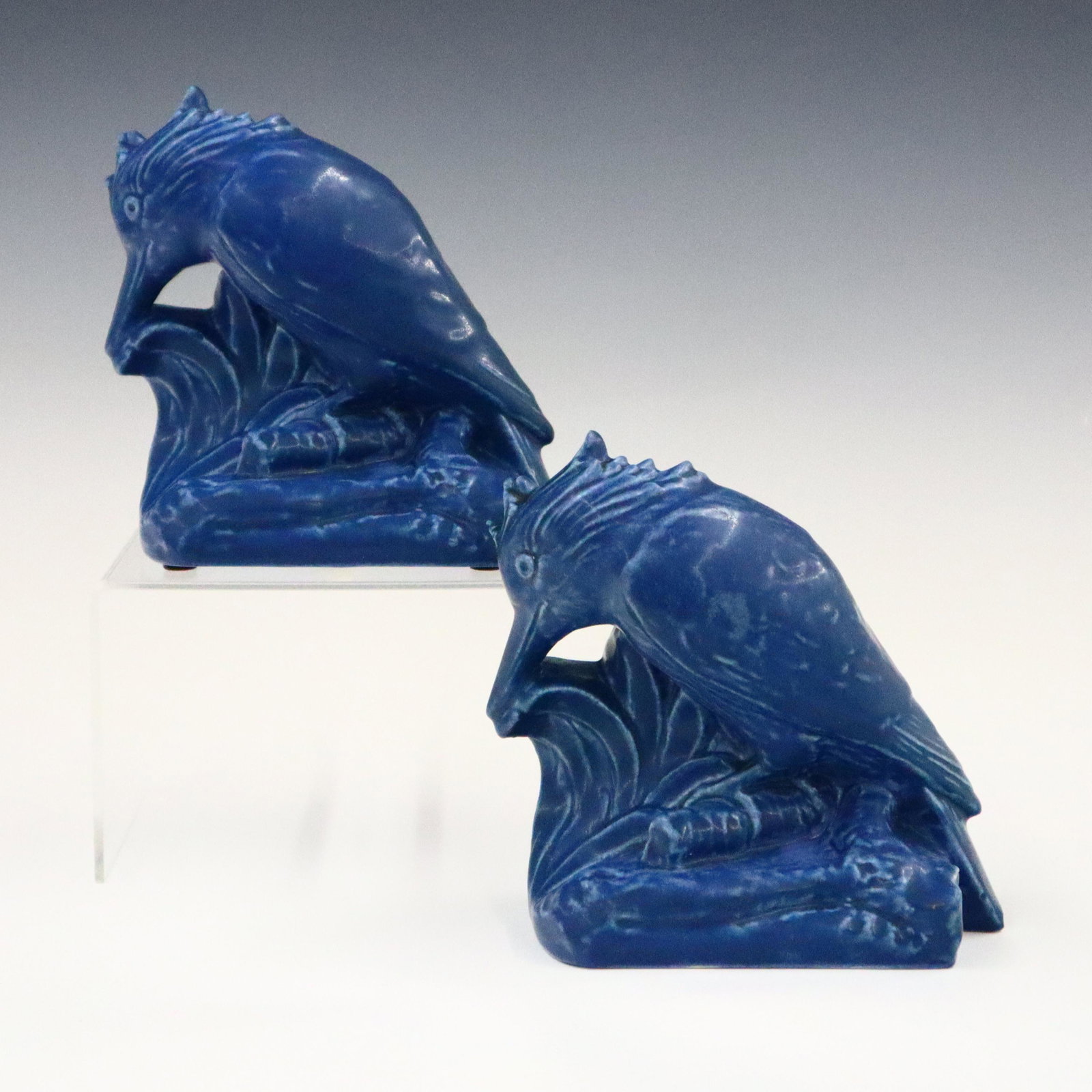Rookwood Kingfisher Bookends: A pair of 20th century Rookwood art pottery Kingfisher book ends. Molded bodies with medium blue glaze decoration. Printed mark "1929", mold number "2657", artist mark "W.D…". Slight wear, small fla