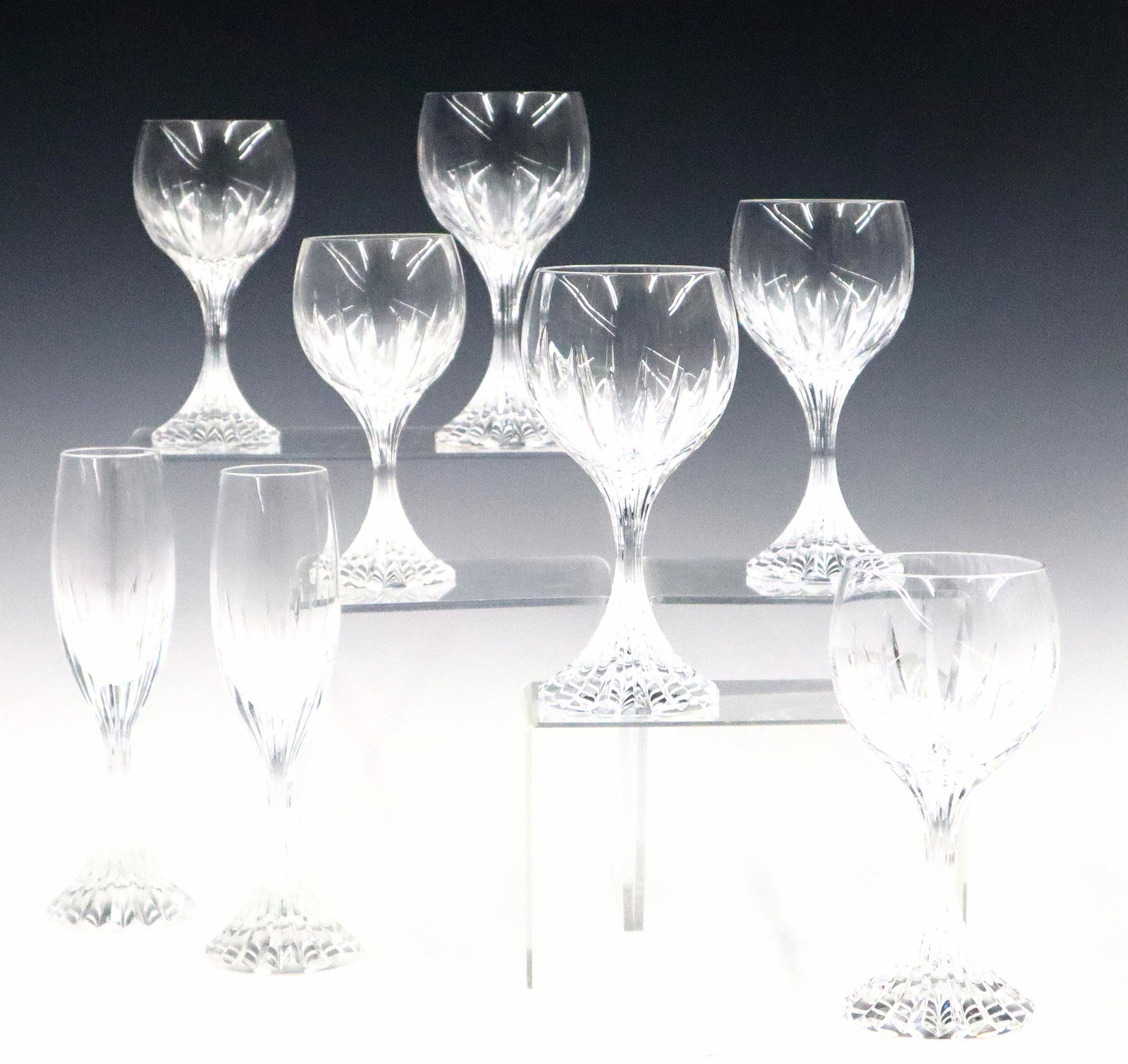 37 Baccarat Massena Pattern Glasses: Thirty-seven pieces of Baccarat Crystal in Massena pattern. Includes eleven 7 1/4" water glasses, fourteen 6 3/4" wine glasses, five 6 1/4" white wine glasses, seven 8 1/2" Champagne flutes. All with 