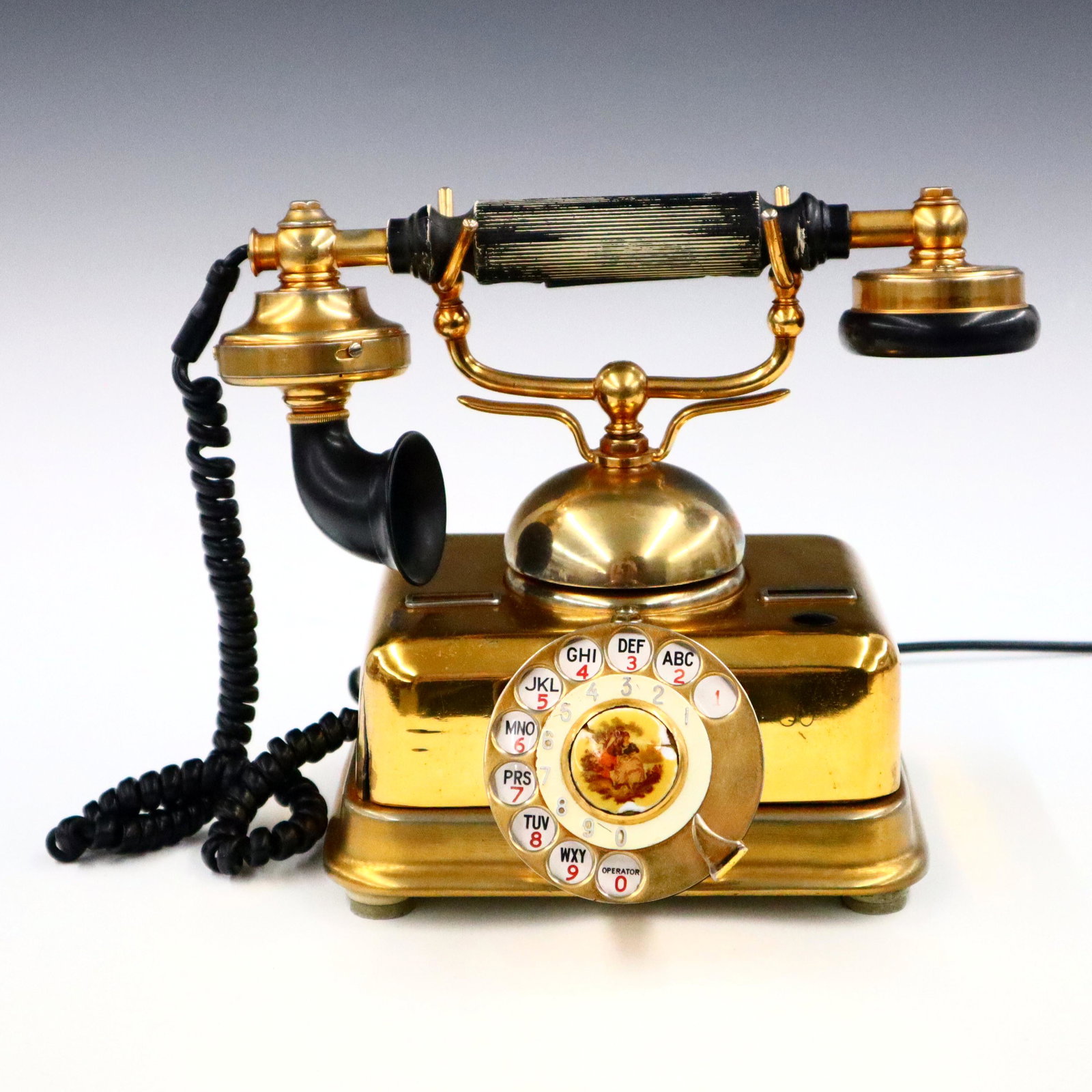 Erikson Table Phone: An early 20th century Erikson table phone. Brass case with Bakelite receiver fittings. Wear and minor damage. 8 1/2" high. ESTIMATE $100-150