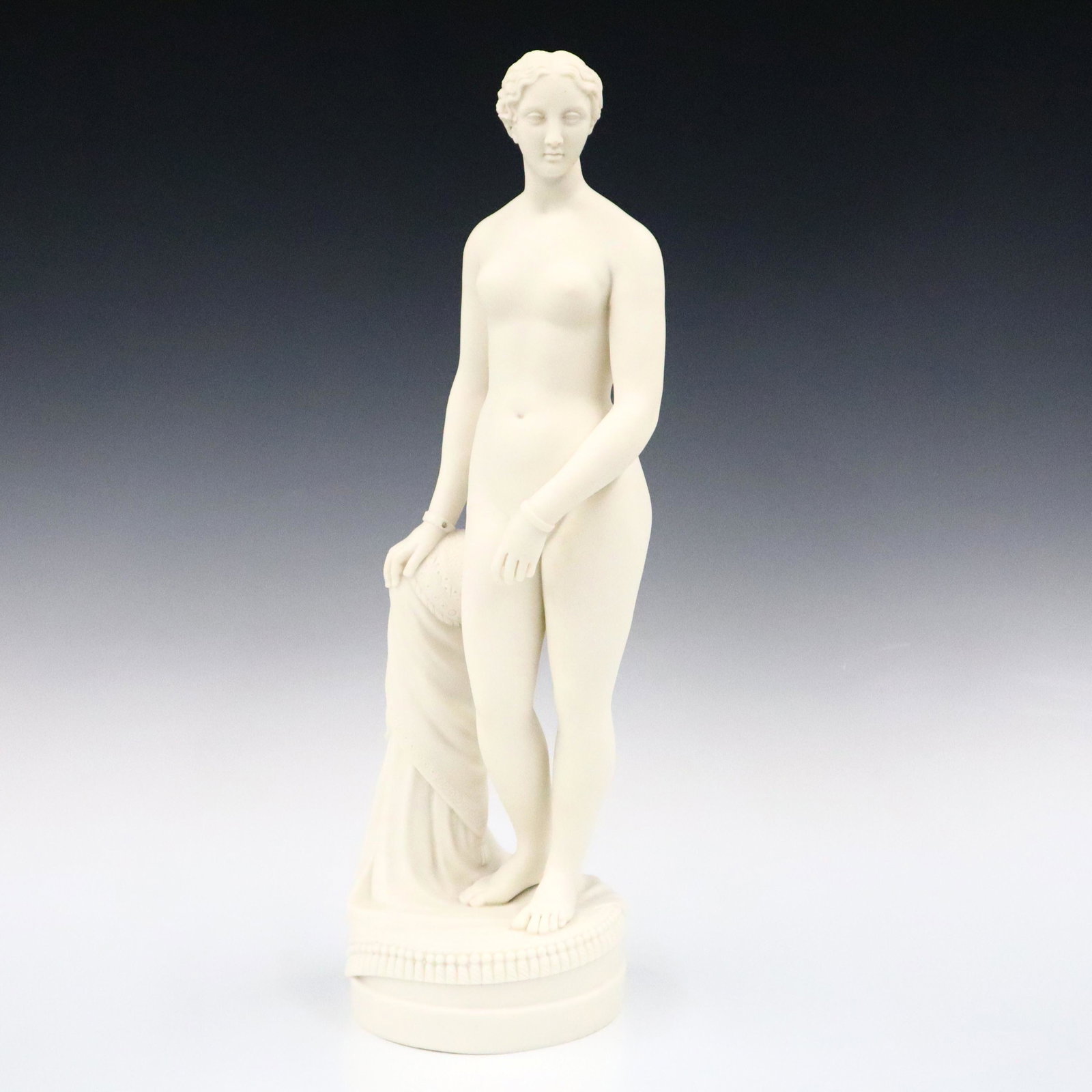 Parian Figure: An early 20th century Parian porcelain figure. Depicts Neoclassical standing female nude. Unmarked, minor wear. 16 1/2" high. ESTIMATE $100-200