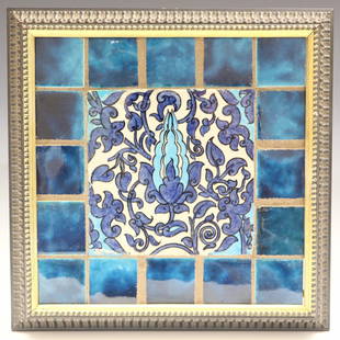 William De Morgan Tile: A late 19th century William De Morgan earthenware tile. Multi color floral and foliate design with smaller Persian Blue tile border. Merton Abbey mark impressed verso. Some damage and repair to