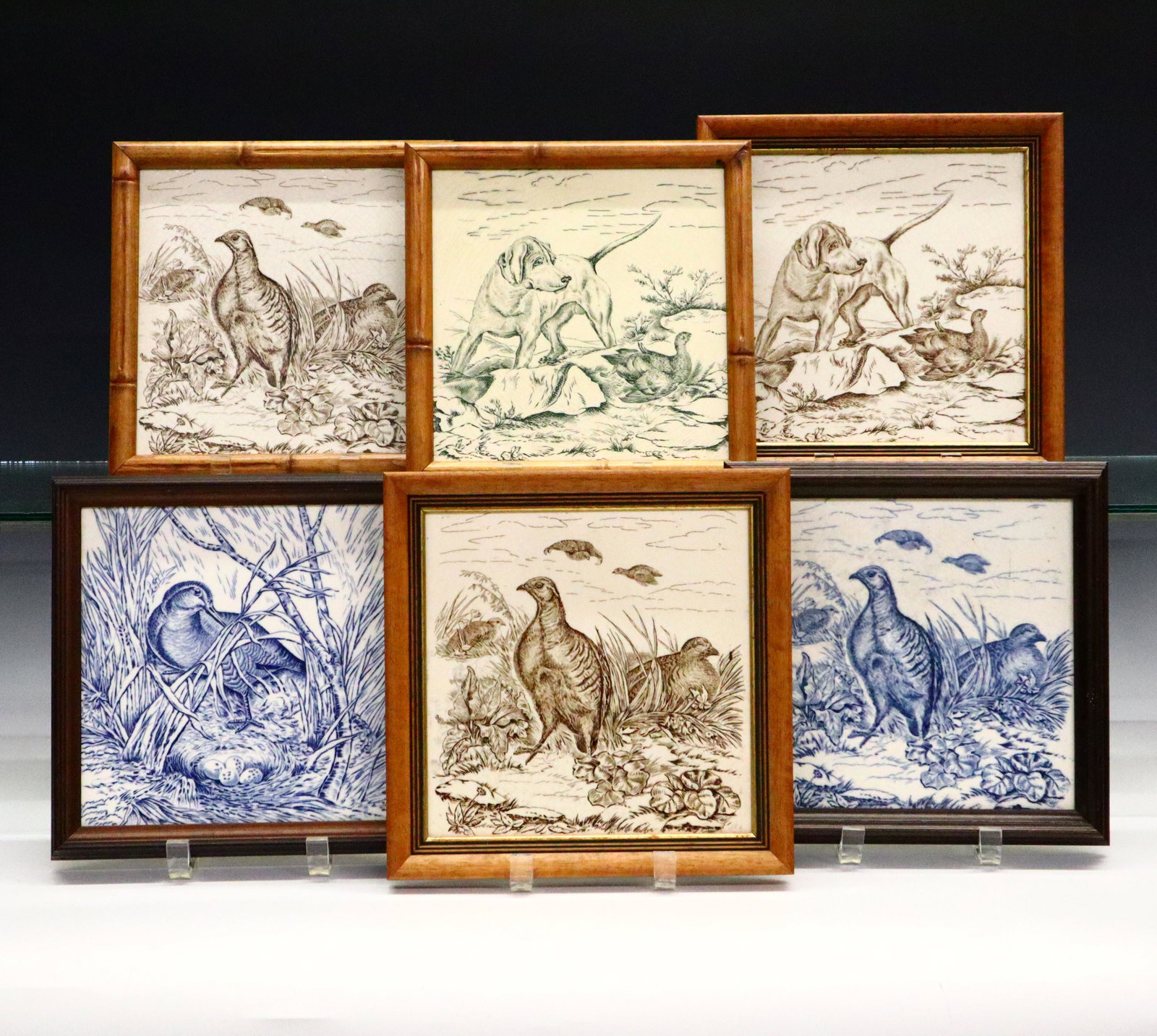6 Wedgwood Tiles: Six late 19th century Wedgwood tiles. From the hunting/game series, three in Blue/Green include "Snipe and Eggs" and "Partridge" with the three in Brown including "Dog with Grouse" and "Partridge" and