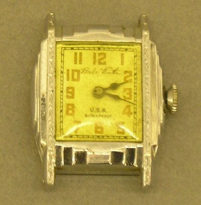 Babe Ruth wrist watch: A Babe Ruth model wrist watch in an Art Deco style case. Wear, lacks band. ESTIMATE $50-100
