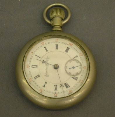 Columbus Watch Co pocket watch: A Columbus Watch Co. open face pocket watch with locomotive engraved on back. 18 size with double sunk dial and damascened plates. Minor wear. ESTIMATE $100-200