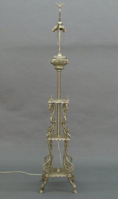 Organ lamp: A turn of the century American late Victorian period Organ lamp. Original Nickel plated finish with embossed font decorated with Minerva heads and Lion's masks, on an embossed stem and intricate three