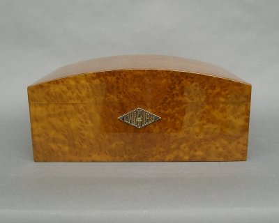 Cartier humidor: Contemporary "Cartier" Burl wood cigar humidor. Arched top with large "Cartier" monogrammed keyhole escutcheon, unused. Limited Edition #762/1000, includes the original humidifier, humidity gauge, div