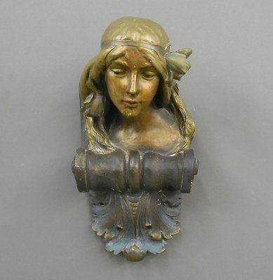 Plaster interior corbel: A turn of the century plaster architectural figural corbel with original painted decoration. Originally from a Detroit area Theatre. Modeled as a Art Nouveau female bust with Doric support scroll. Wea