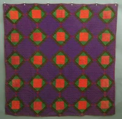 Amish quilt: A mid 20th century Amish patchwork quilt. Diamond Center pattern in Purple, Red, Green and Black. Wear, some damage and staining. 79 1/2 x 79 1/2" overall. ESTIMATE $300-500