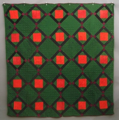 Amish quilt: A mid 20th century Amish patchwork quilt. Diamond Center pattern in Green, Red, Black and Purple. Wear, some damage and staining. 78 x 81" overall. ESTIMATE $300-500