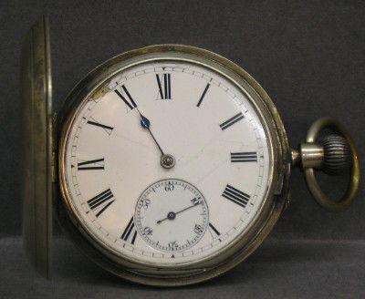 J Bennett Sterling pocket watch: A late 19th century Sterling Silver pocket watch by John Bennett, interior plate marked "Maker To The Royal Observatory, John Bennett, 64 & 65 Cheapside, London", serial #39404. Stem wind pin set 39mm