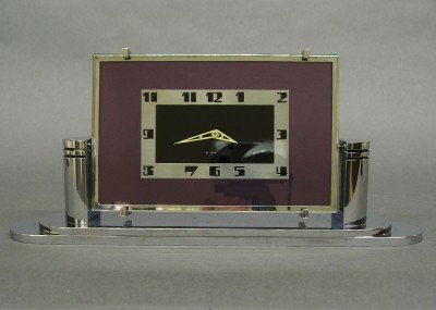 Tavannes Art Deco desk clock: A 20th century Swiss Art Deco Period desk clock by the "Tavannes Watch Co". 8-day watch type movement in a Chrome case with a Black and Chrome face and Amethyst glass. Marked under base "Tavannes Watc