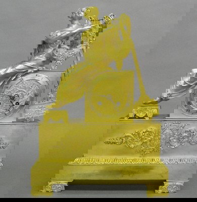 French Ormolu Figural clock: A 19th century French Gilded Bronze mantle clock with a figure of the Greek Muse Terpsich'ore. 8-day spring driven time and strike movement with silk thread suspension and cast Gilded dial. Gilded fig