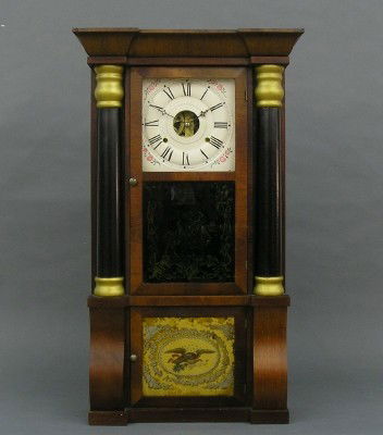 Seth Thomas shelf clock: A 19th century Seth Thomas column shelf clock. 8 day weight driven time and strike movement with arched plates and painted metal dial. Mahogany case with arcaded cornice, turned half columns and two d