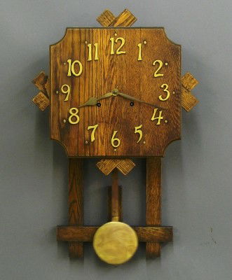 Gilbert Mission wall clock: A 20th century Gilbert "San Remo" model Mission wall clock. 8 day spring driven time and strike movement with an Oak dial. Oak case with stick work detail. In running order. Old finish with minor wear