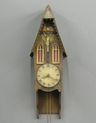 Black Forest wall clock: An early 20th century Black Forest wall clock. 30 hour weight driven time and strike movement with wood plated and metal gears. Gothic Cottage style case with Crucifix and hand painted detail. Old fin