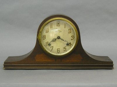 Ingraham Tambour Mantle clock: A 1930's period Ingraham Tambour Mantle clock. 8 day spring driven time and strike movement with painted dial. Mahogany case with molded base and "Inlaid" detail. Older finish with some wear. 9 1/2" h