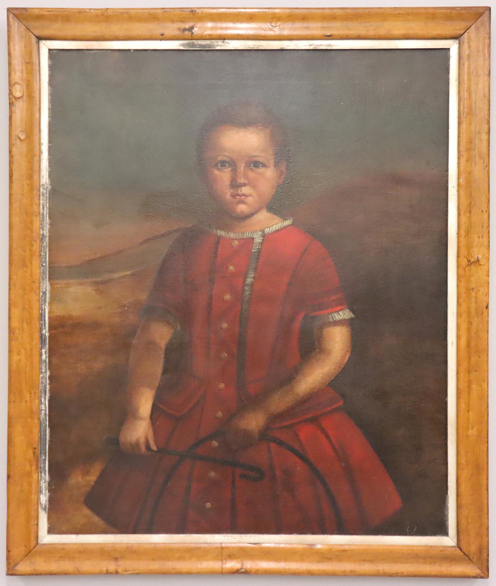 English Oil on Canvas Portrait: A 19th century English oil on canvas portrait. Depicts a young girl in a Red dress holding a period hoop toy. Unsigned. Lined with some older repairs. Image 24 x 28" high, in a Birdseye Maple frame wi