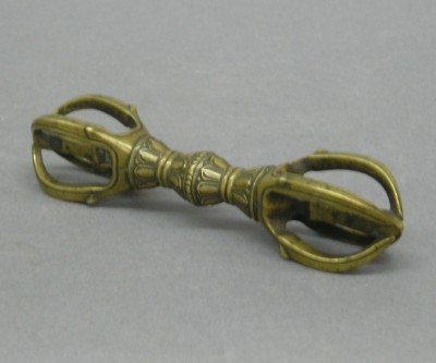 Tibetan Bronze Vajra Scepter: A 19th century Tibetan Bronze Vajra Scepter. Buddhist ritual object representing spiritual power. Double lotus blossom center with claw shaped prongs coming to a point at both ends, used in Tantric ce