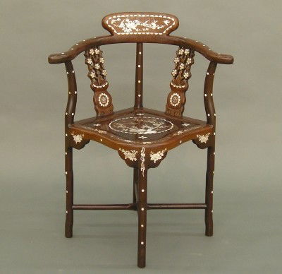 Chinese inlaid corner chair: A late 20th century Chinese hardwood corner chair. Extensive Mother-of-Pearl inlaid decoration. Wear and minor loss. 32" high. ESTIMATE $100-200