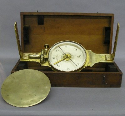 Gennert & Holzke Surveyor's compass: A mid 19th century Surveyor's compass by "Gennert & Holzke, New-York". Brass compass with Silvered dial with detachable ends and Brass protective dial cover in a fitted, dovetailed Cherry case. Some w
