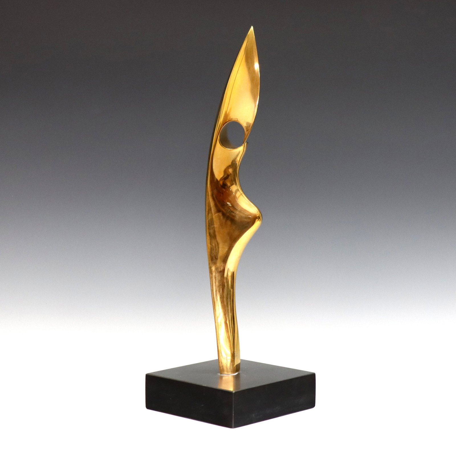 Kieff Bronze Sculpture: Antonio Grediaga Kieff, Spanish/Canadian, b. 1933. Abstract sculpture in polished Bronze on a Black stone base. Signed and annotated "Kieff 3/6". Slight surface wear. 14 1/2" high plus the 5 x 5 x 1 1