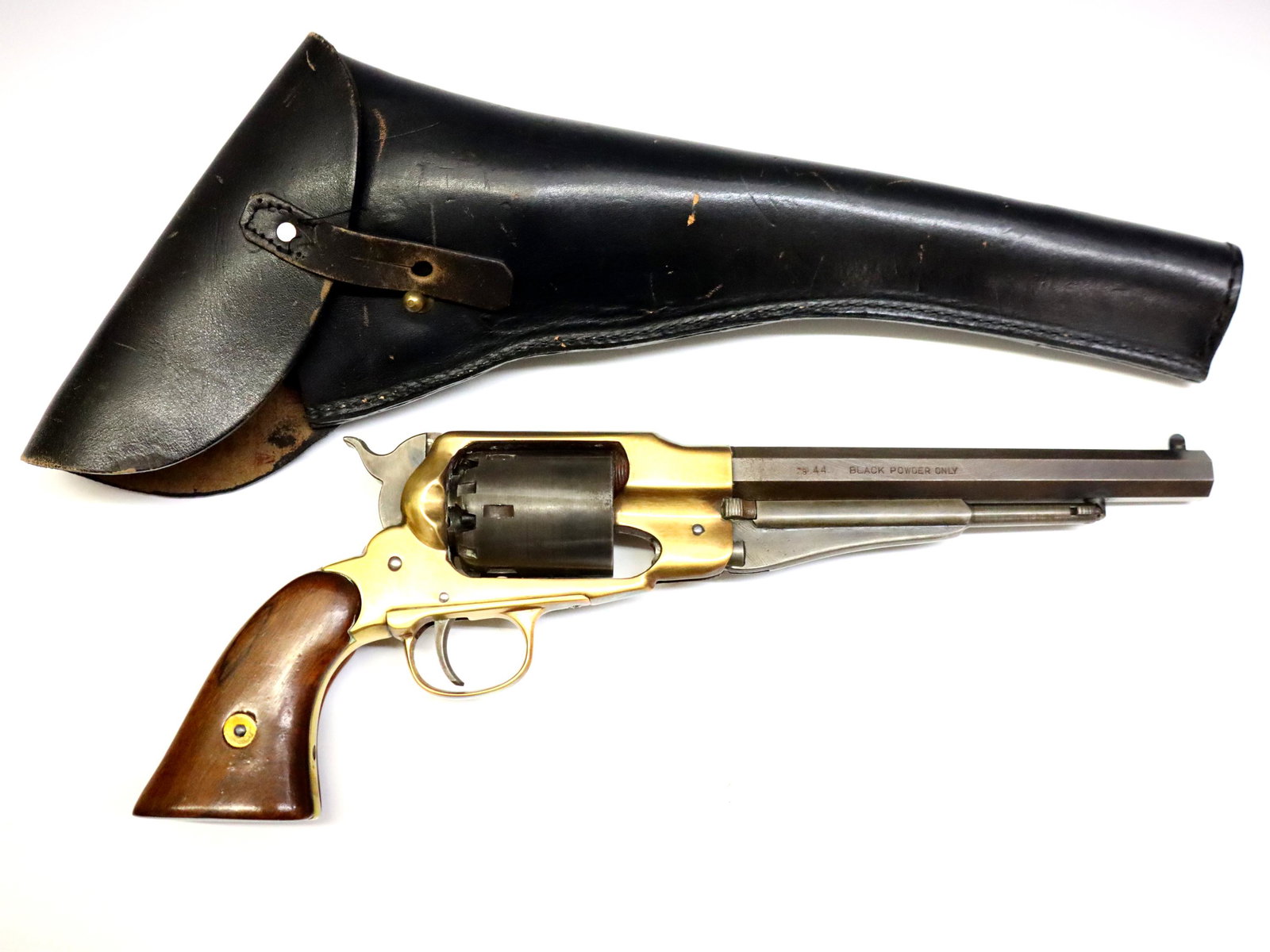 Uberti Replica 1858 Remington Revolver: An Uberti replica 1858 Remington black powder revolver. .44 caliber, 6 shot, rifled 7 3/4" octagonal barrel, with a Walnut grip and Brass frame. Impressed "Made in Italy" with "Cal. 44" and "Black Pow