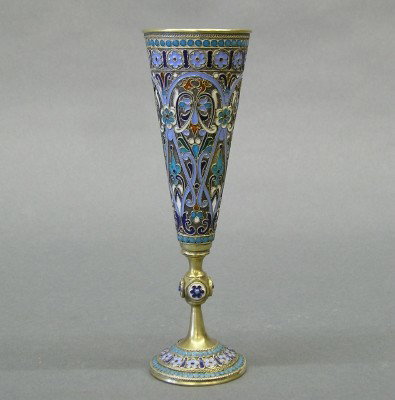 Russian Enameled Silver cup: A Russian Silver footed cup with extensive multi-color enameled decoration. Faint hallmarks. Minor wear. 6 1/4" high. ESTIMATE $200-400
