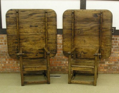 Pr of Hutch tables: A pair of late 19th century Elm wood Hutch tables (place together for use as one long table). Squared four board plank tops swing up for seating on mortise and tenon bases with pegged joints and plank