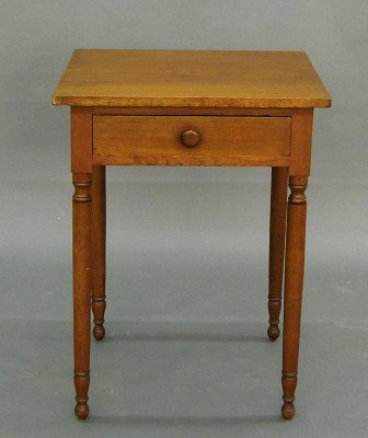 Cherry lamp table: A 19th century American Cherry Country Sheraton lamp table. Rectangular top with single dovetailed drawer and simple turned legs. Older refinishing with some wear. 21 1/2 x 18 1/2 x 29" high. ESTIMATE