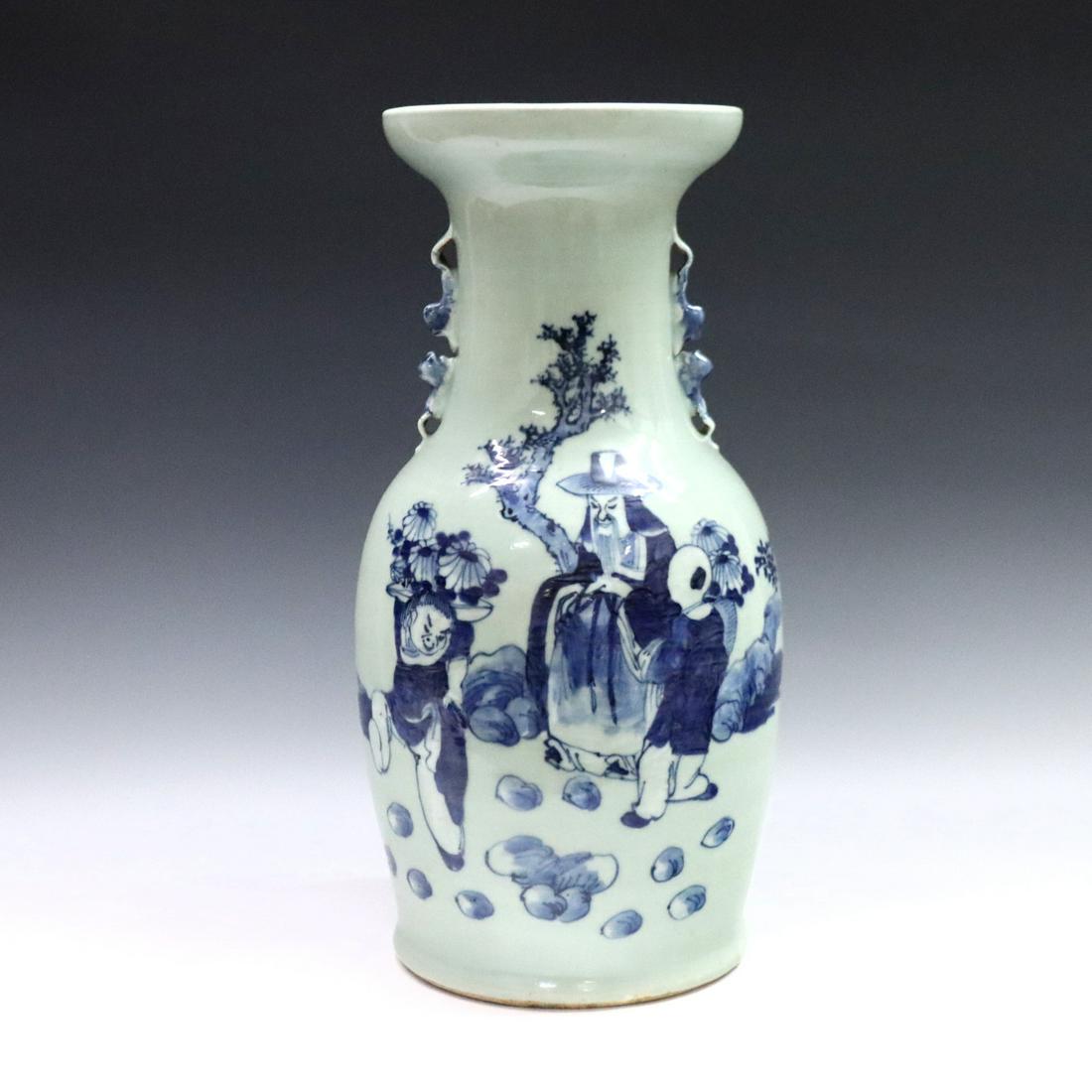 Chinese Baluster Vase: A Chinese porcelain baluster vase with molded Foo Dog handles. Hand-painted Blue and Celadon decoration depicting a scholar seated in a garden with two attendants. Unmarked, minor wear with hairlines