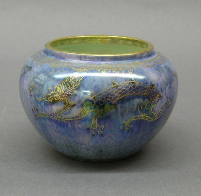 Wedgwood luster bowl: An early 20th century Wedgwood luster ware bowl. Blue mottled glaze, decorated with Butterflies and Peacocks in hand gilded detail. Printed "Portland Vase" mark, with "Zx829". Slight wear. 4 1/2" diam