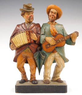 German Double Whistler Figure: A 20th century German clockwork "Whistler" automaton with two musicians. Spring driven movement in each figure turns the head and whistles when activated. Hand carved wooden construction with