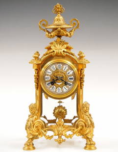 French Louis XV Mantel clock: A 19th century French Louis XV style mantel clock by "E G". 8-day time and strike movement with Gilded Bronze dial and porcelain hour markers with Roman numerals marked "E + G" with a cross and origin