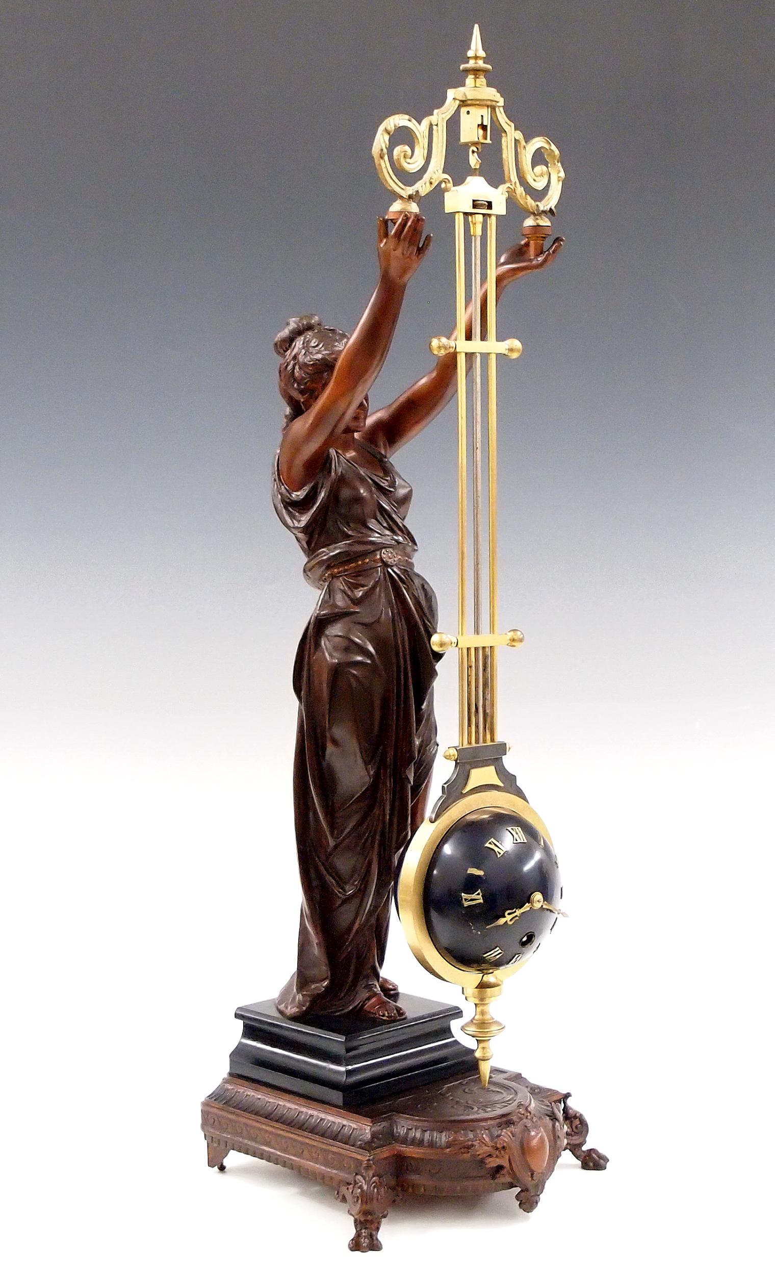 A Guilmet Figural Upside-Down Swinging Clock (1 of 6)