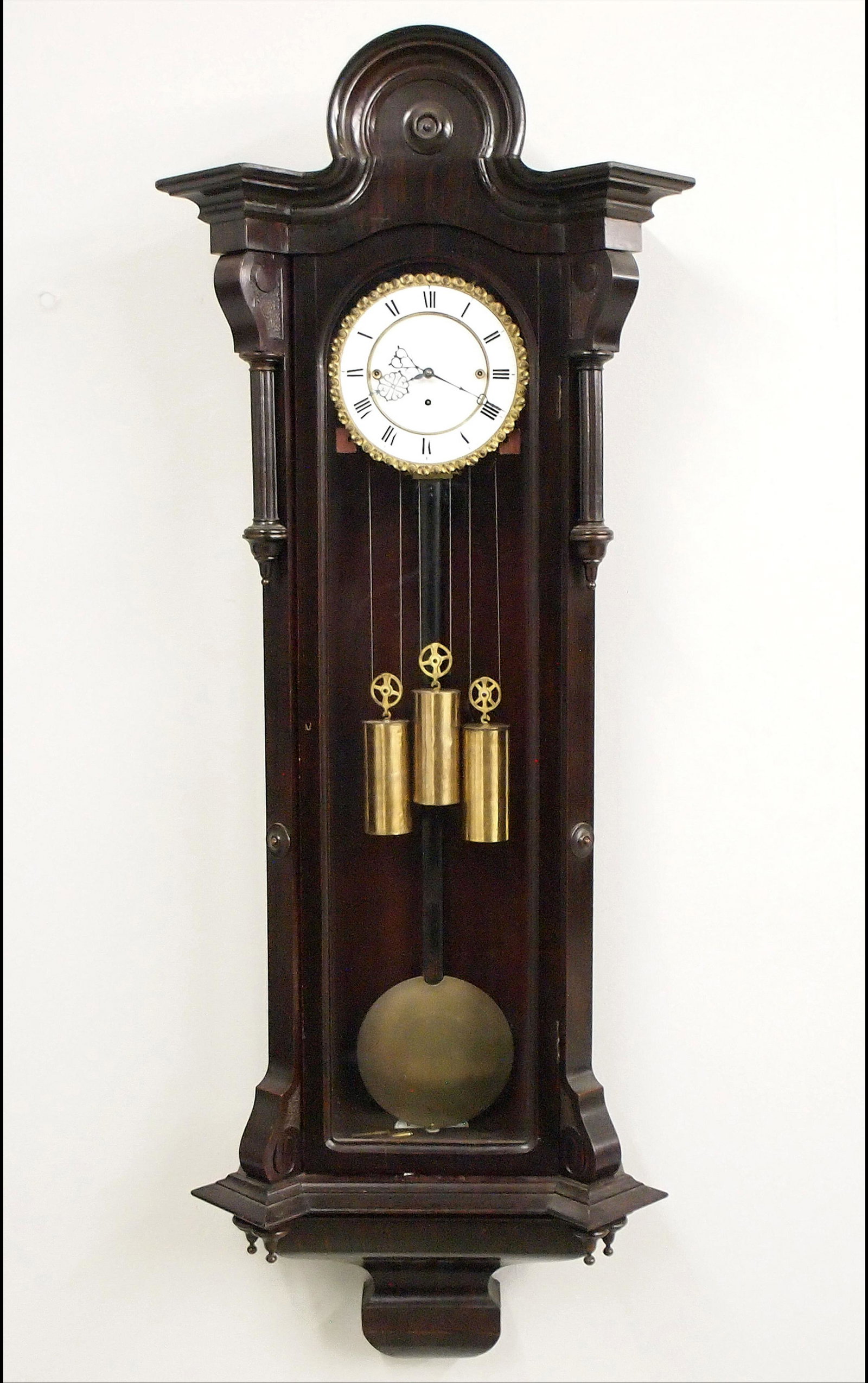 3 Weight Vienna Regulator: A 19th century Vienna Regulator wall clock. 8-day weight driven movement with quarter hour Grand Sonnerie strike and a two-part porcelain dial with Roman numerals and a Brass Piecrust bezel. Transitio