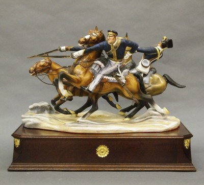 Michael Sutty porcelain figure: A Michael Sutty bone china figure entitled "The Charge of the Light Brigade". Three Cavalry men in full charge, highly detailed with hand painted decoration. Number 41 from an edition of 50. Printed m