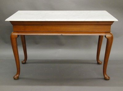 Queen Anne serving table: An 18th century American Queen Anne Mahogany serving table from Newport RI. Molded White marble top on a base with deeply molded skirt, cabriole legs and pad feet. Refinished with some repair, replace