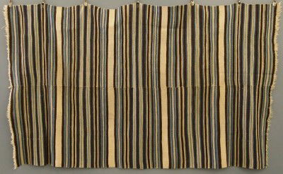 Southwestern rug: An early 20th century Southwestern rug. "Rio Grande" type with Blue, Brown and White alternating bands. Woven in two sections and seamed together. Some fading, edge wear and worn areas. 86 x 51" overa