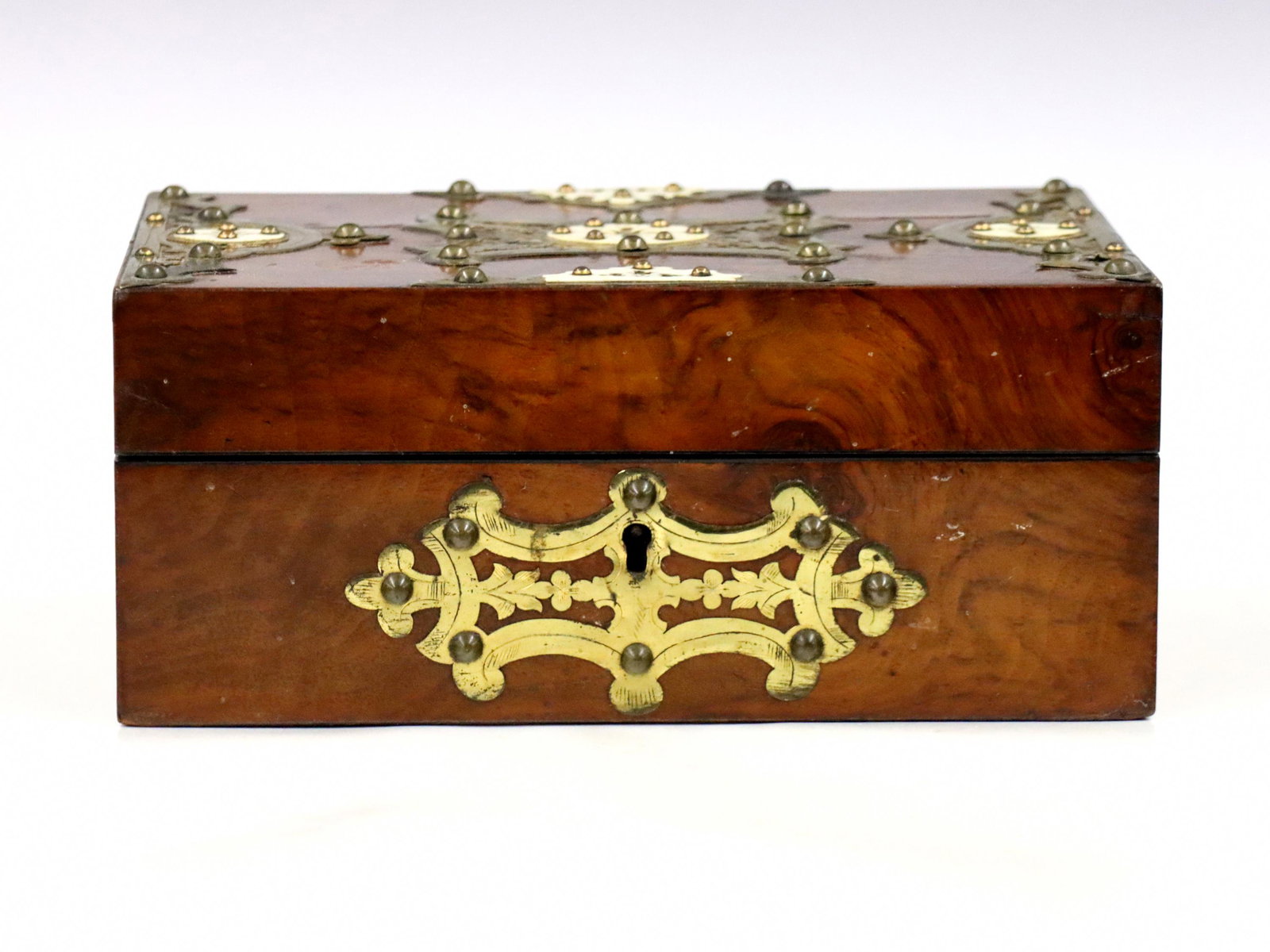 British Sewing Box: A 19th century British sewing box. Burl Walnut construction with applied Brass and Bone detail. Hinged top opens to a silk lined fitted interior with removable tray, lower storage compartment, and doc