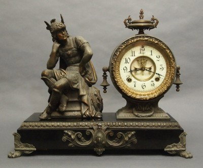 Ansonia figural mantle clock: A turn of the century Ansonia "Hermes" model figural mantle clock. 8-day time and strike movement with porcelain dial and open escapement. Cast Spelter patinated case and figure on an Iron base. Some 