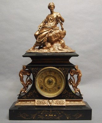 Ansonia mantle clock: A turn of the century Ansonia "Rosalind" model Iron mantle clock with patinated Spelter figure. 8-day time and strike movement. Some wear, touchups. 22" high overall. ESTIMATE $100-200