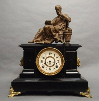 Ansonia mantle clock: A turn of the century Ansonia "Palmero" model Iron mantle clock with patinated Spelter figure. 8-day time and strike movement. Minor wear, restored dial. 19" high overall. ESTIMATE $100-150