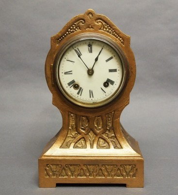 Ansonia mantle clock: A turn of the century Ansonia Iron mantle clock. 8-day time and strike movement with porcelain dial. Case repainted, dial lacks one winding hole bushing. 11" high. ESTIMATE $100-150